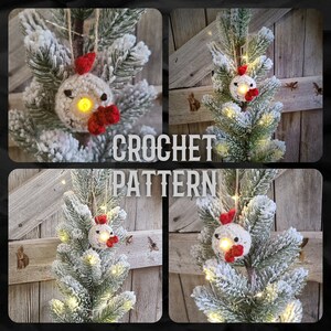 May include: A crocheted chicken ornament with red accents hangs on a snowy artificial Christmas tree with white lights. The ornament has a white face with black eyes and a red beak. CROCHET PATTERN is written in the image.