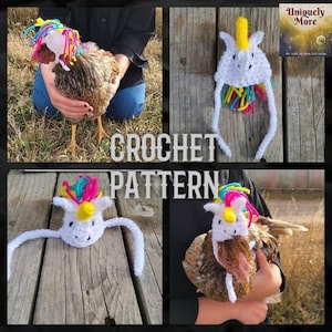 May include: A crochet unicorn hat for a chicken. The hat is white with a yellow horn, pink and blue mane, and long white ties. The hat is on a chicken with brown feathers.