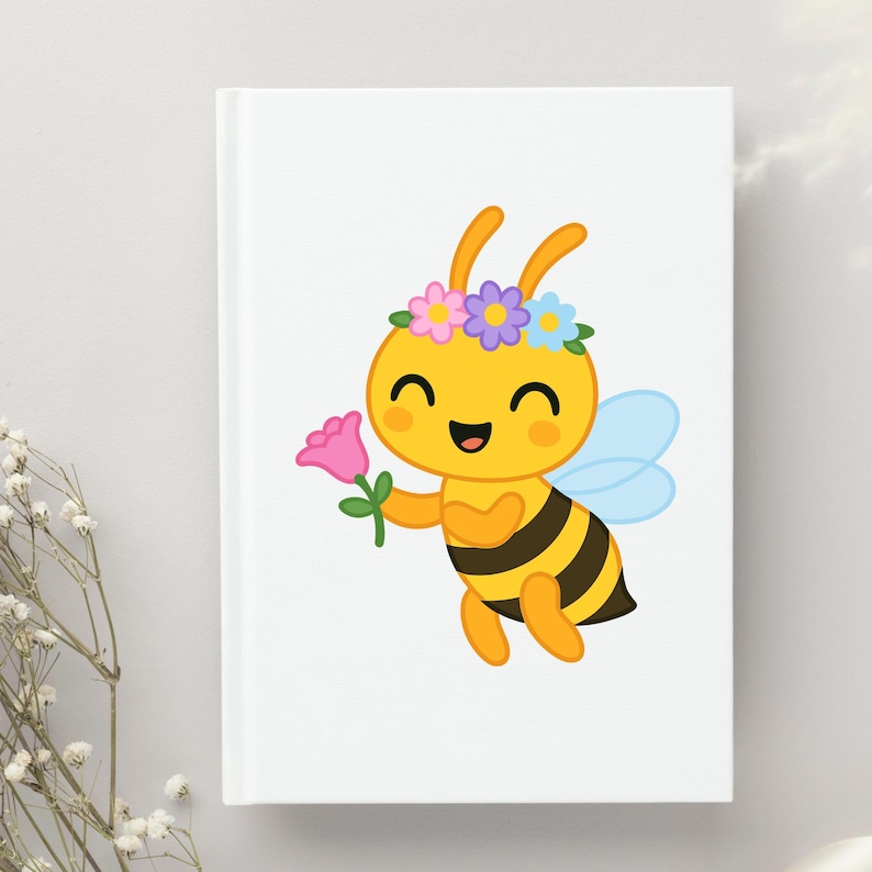 May include: A white notebook featuring a cartoon bee with a flower crown and a pink flower. The bee is yellow with black stripes and blue wings. The bee is smiling and holding a pink flower.