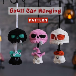 May include: Crocheted Halloween car hangings in black, pink, and white skull designs, with a monster and ghost. The text reads "Skull Car Hanging" and "Pattern". These handmade ornaments add a spooky touch to any vehicle.