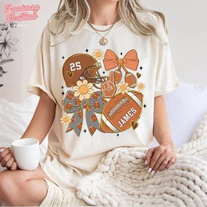 CUSTOM Football Shirt, Personalized Name Football Bow T-Shirt, Coquette Football Mom Gift, Game Day Football Season Tee, Football Mom Tee