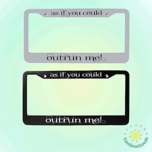 May include: Two license plate frames, one silver and one black, are displayed. The silver frame has the text "as if you could" above and "outrun me!" below. The black frame has the same text. Both frames have mounting holes.
