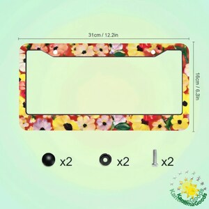 May include: A car license plate frame featuring a floral design with yellow, pink, and white flowers on a red backdrop. The frame is 31cm long and 16cm high. Includes mounting hardware: screws, washers, and screw caps.