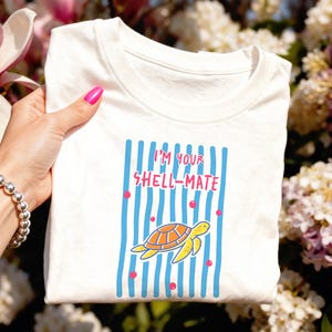 May include: A set of three ceramic mugs with a speckled, matte finish. The mugs are in shades of cream, light gray, and dark gray. Each mug has a simple, minimalist design, perfect for coffee or tea.