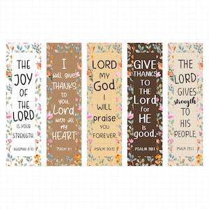 May include: Set of five rectangular bookmarks with floral designs and inspirational quotes. Each bookmark features a different background color, with text in black. The quotes are from the Bible.