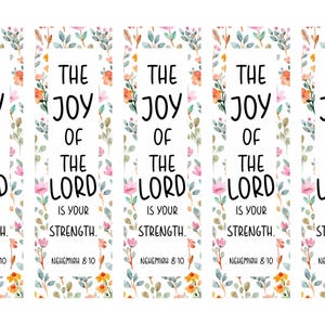 May include: Bookmarks with the text "The Joy of the Lord is Your Strength" and the Bible verse Nehemiah 8:10. Each bookmark has a floral border with pink, orange, and green watercolor elements.