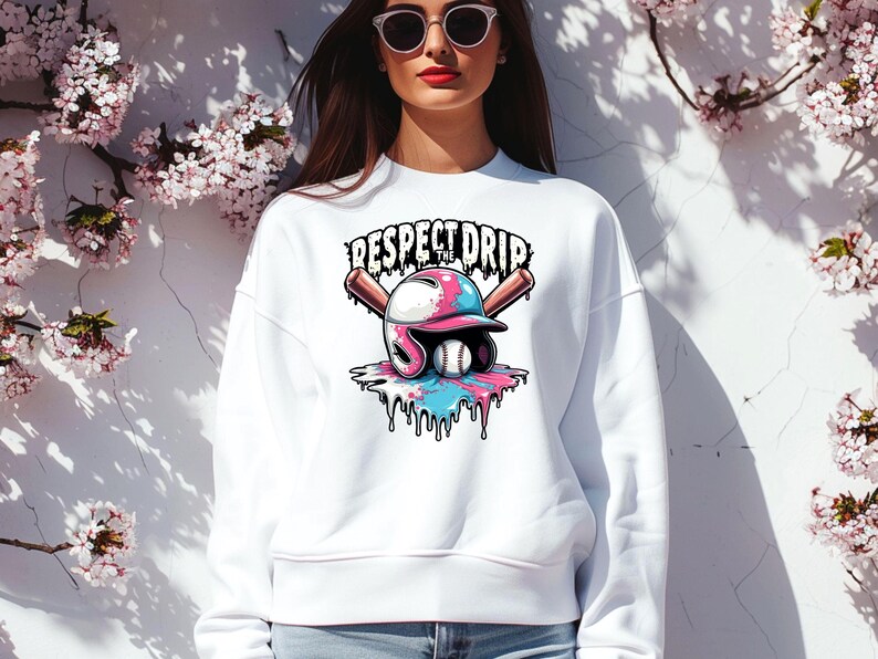 May include: White sweatshirt with a graphic of a baseball helmet with pink and blue paint dripping down. The text "Respect the Drip" is above the helmet.