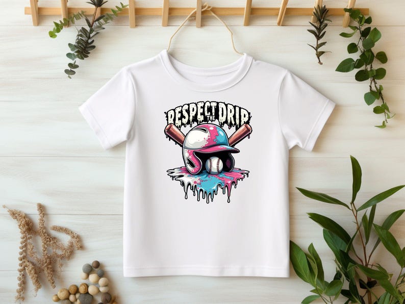 May include: White t-shirt with a graphic of a baseball helmet with dripping paint and two baseball bats. The text "Respect the Drip" is above the graphic.
