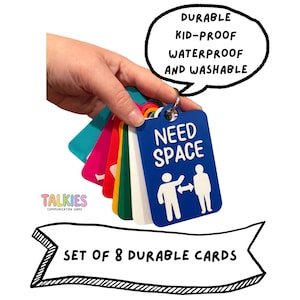 May include: A set of 8 colourful communication cards on a metal ring. The blue card features the white text NEED SPACE and a graphic of two figures with a double-sided arrow between them. A speech bubble reads DURABLE KID-PROOF WATERPROOF AND WASHABLE.