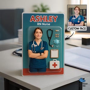 May include: A teal and red package features the name "ASHLEY" and "RN Nurse" in white text. The package contains a photo of a woman in blue scrubs, a stethoscope, medical supplies, and a "CUSTOM FACE" option.