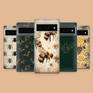 May include: Five different phone cases with bee designs. The cases are all clear and show different bee patterns, including a watercolor bee, a honeycomb pattern, and a bee with a floral design.