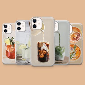 May include: Set of four clear phone cases with different illustrations of iced drinks. The cases feature a variety of drinks, including iced coffee, iced tea, and lemonade. The cases are all clear and have a white border.