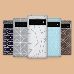 May include: Five phone cases with geometric designs. Patterns include a navy blue case with gold lines, a grey case with a triangle pattern, a white case with black lines, a light blue case with a hexagon pattern, and a brown case with gold chevrons.