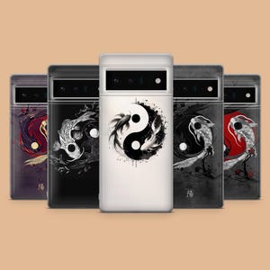May include: Five phone cases with different designs featuring a yin yang symbol and koi fish. The cases are black, white, and gray with a black and white yin yang symbol and black and white koi fish.