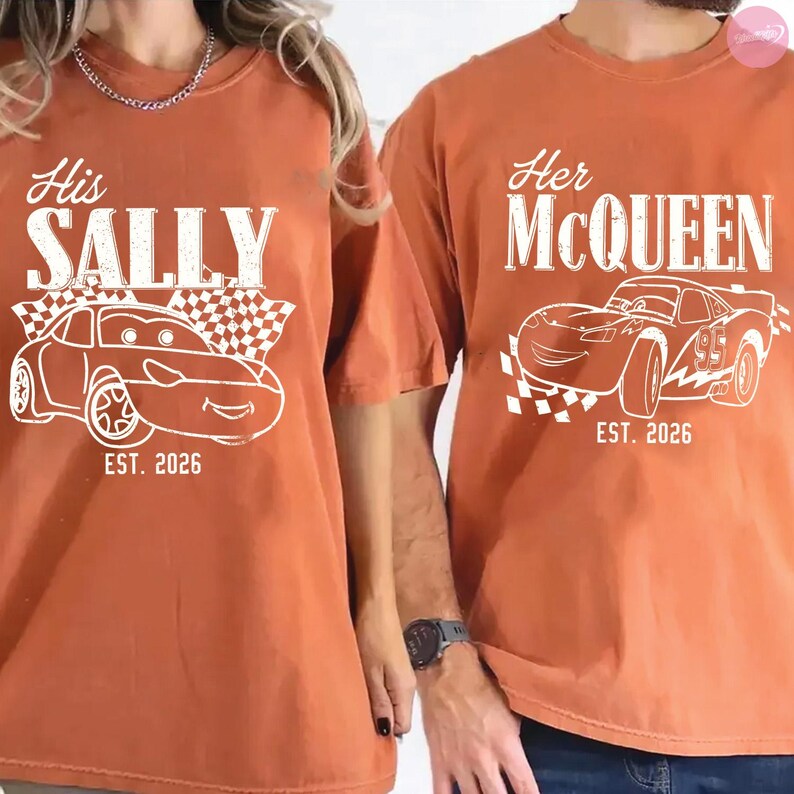 May include: Two rust-colored t-shirts with white graphics. One shirt says "His SALLY" with a car design and "EST. 2026". The other says "Her McQUEEN" with a car design and "EST. 2026".