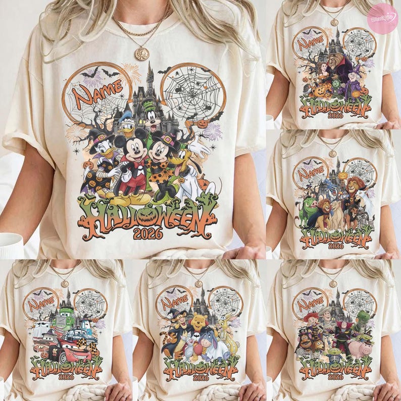 May include: A cream-colored t-shirt featuring a graphic print of various cartoon characters in Halloween costumes, a castle, spider webs, and the text "Name" and "Halloween 2026". The design is arranged within two large circular outlines.