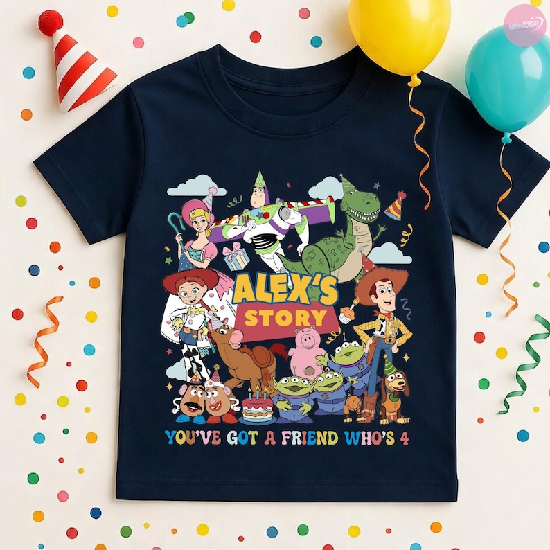 May include: Navy blue t-shirt featuring a colorful graphic of characters from the animated movie Toy Story. The design includes the text "Alex's Story" and "You've Got a Friend Who's 4". Party balloons and confetti are in the background.