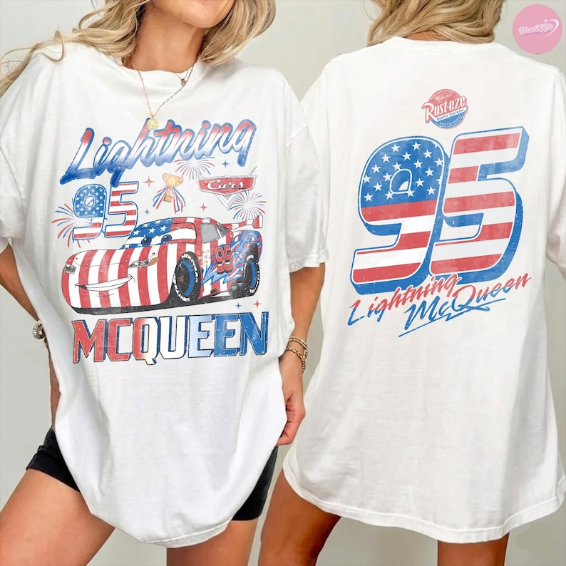 May include: White t-shirt featuring a graphic of Lightning McQueen from the Cars movie. The design includes the number 95, the character's name, and patriotic red, white, and blue colors. The back of the shirt also displays the number 95 and Lightning McQueen.
