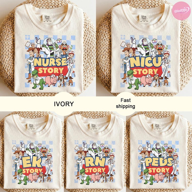 May include: Ivory t-shirts with a colourful Toy Story character graphic. Each shirt displays different text: Nurse Story, NICU Story, ER Story, RN Story, and PEDS Story. The shirts are folded on a woven surface.