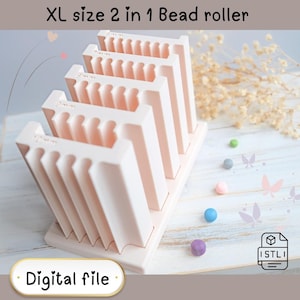 May include: A light pink XL size 2 in 1 bead roller with the text "XL size 2 in 1 Bead roller" and "Digital file". The roller has multiple slots labeled "9mm". Several colorful beads are scattered around the roller.
