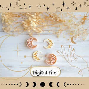 May include: Four crescent moon-shaped objects with leaf designs, in shades of orange and white, are arranged on a light wood-grain surface. The words "Digital file" are in a white oval. The image has celestial-themed illustrations and dried flowers.