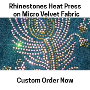 May include: Teal micro velvet fabric featuring a floral pattern created with iridescent rhinestones. The text at the top reads Rhinestones Heat Press on Micro Velvet Fabric and the text at the bottom reads Custom Order Now.