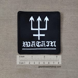 May include: Black square patch with a white trident symbol and the word "MATAIN" in gothic lettering. The patch is approximately 3 inches wide and 3 inches tall.