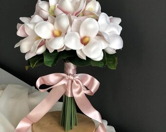 Bouquet with favorite bridal flower and gift groom&#39;s boutonniere. white magnolia and eucalyptus arrangement + gift groom boutonniere