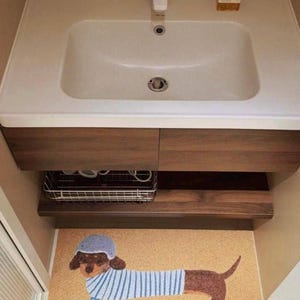 The easy-to-clean, soft material makes the dachshund doormat a great choice for the bathroom.
