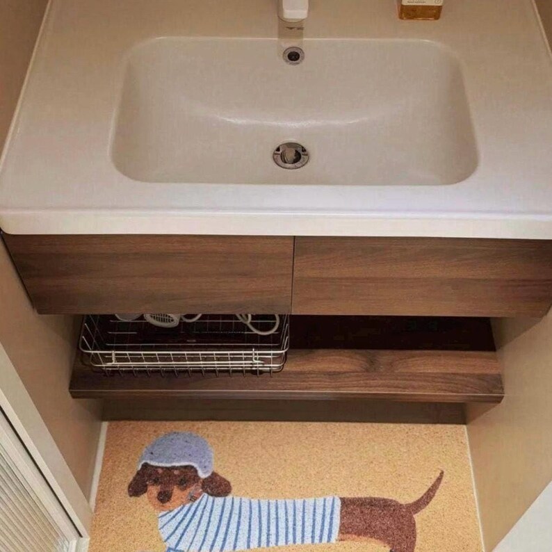 The easy-to-clean, soft material makes the dachshund doormat a great choice for the bathroom.