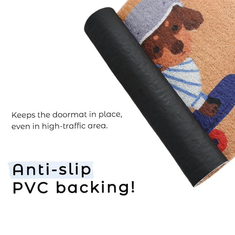 May include: A rolled-up doormat with a cartoon dog design, featuring a brown dog wearing a blue and white striped shirt and a gray hat. The doormat has anti-slip PVC backing. Text on the image reads: "Keeps the doormat in place, even in high-traffic area."