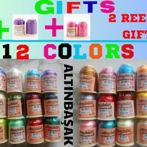 May include: An image featuring 12 spools of colorful thread, with the text "GIFTS 2 REELS GIFT 12 COLORS". The spools are arranged in rows, showcasing a variety of colors, including blue, pink, and gold. Each spool has a label.