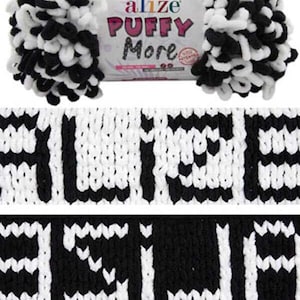 May include: A skein of Alize Puffy More yarn in black and white. The yarn has a textured, looped appearance. The packaging displays the brand name and product name in pink and white. The image also shows a close-up of the knitted yarn.