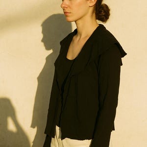 Black avant garde wool jacket size it 44 distressed raw hem lana cocida sculptural collar artisanal textured minimalist fashion