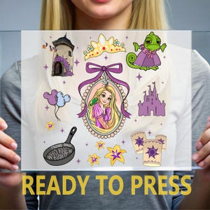 May include: A collection of cartoon illustrations featuring a princess, a tower, a castle, a chameleon, balloons, a frying pan, and lanterns. The text "READY TO PRESS" is at the bottom in yellow.