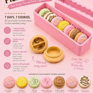 May include: A pink rectangular pill organizer box containing seven small round cookie-shaped containers. Each container features a different decorative top resembling various cookie flavors like confetti, lemon, mint, strawberry, and chocolate.