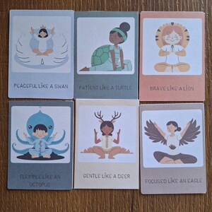 May include: Six colorful cards with illustrations of animals and people in yoga poses. Each card has a phrase describing the animal's qualities, such as "Peaceful like a swan" or "Brave like a lion".