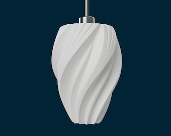 May include: A white, modern pendant light fixture with a swirling, textured design. The light hangs from a silver-colored metal fixture against a dark blue background. The shade has a unique, sculptural shape.