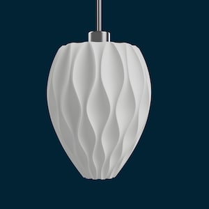 May include: White pendant light fixture with a wavy, textured design. The light hangs from a silver-colored metal fixture against a dark blue background. The light fixture has a teardrop shape.