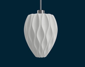 May include: White pendant light fixture with a wavy, textured design. The light hangs from a silver-colored metal fixture against a dark blue background. The light fixture has a teardrop shape.