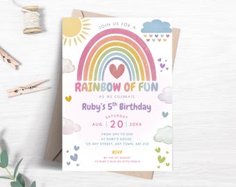 May include: A colorful birthday invitation with a rainbow design. The text reads "Rainbow of Fun" and "Ruby's 5th Birthday." The invitation includes details for the party, such as the date, time, and location. The invitation is on a white background with a light brown envelope.