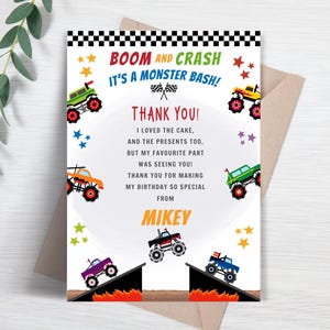 May include: A colorful birthday thank you card with monster truck graphics. The card features the text "BOOM AND CRASH IT'S A MONSTER BASH! THANK YOU!" and includes a message from Mikey. The card has a white background with a brown envelope.