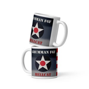 May include: Two white ceramic mugs stacked on top of each other. Each mug features a design with a white star inside a navy blue circle with a red center, the text "GRUMMAN F6F" and "HELLCAT" in red.