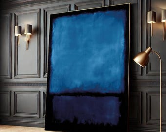 May include: A large abstract painting with a dark blue and black color scheme. The painting is framed in a thin gold frame and is hanging on a dark wall.