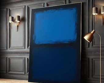 May include: A large abstract painting with two horizontal bands of blue paint. The top band is a lighter shade of blue than the bottom band. The painting is framed in a thin gold frame and is hanging on a dark wall.