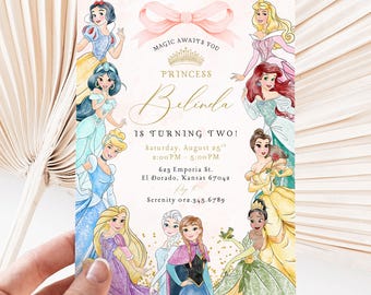 May include: A pink and gold princess-themed birthday invitation with a crown and a bow. The invitation features a variety of Disney princesses, including Snow White, Cinderella, Ariel, Belle, and Elsa. The text on the invitation reads "Magic Awaits You Princess Belinda is Turning Two!" and includes the date, time, and location of the party.