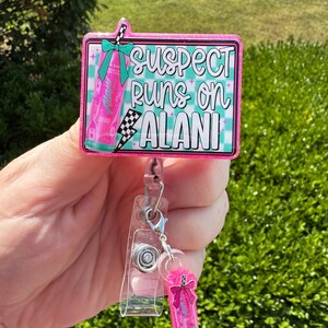 Suspect Runs on Alani badge reel, nurse badge reel, teacher badge reel, glitter badge reels, id holder, energy drink badge reel, and charm