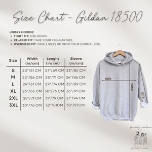 May include: A light gray Gildan 18500 unisex hoodie with a size chart. The chart provides measurements in inches and centimeters for width, length, and sleeve length, ranging from size S to 3XL. The hoodie is displayed on a hanger.