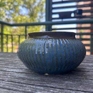 Handmade ceramic blue and rust colored vase, textured design