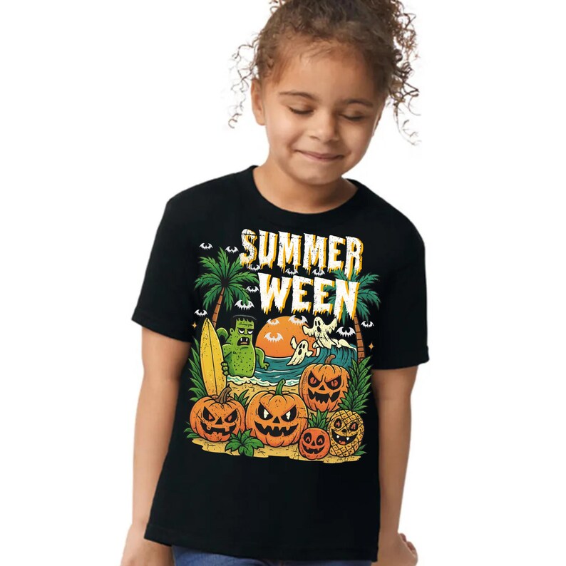 May include: Black t-shirt featuring a colorful graphic with the text "SUMMER WEEN". The design includes pumpkins, a monster, ghosts, palm trees, and a surfboard, creating a Halloween-themed beach scene.